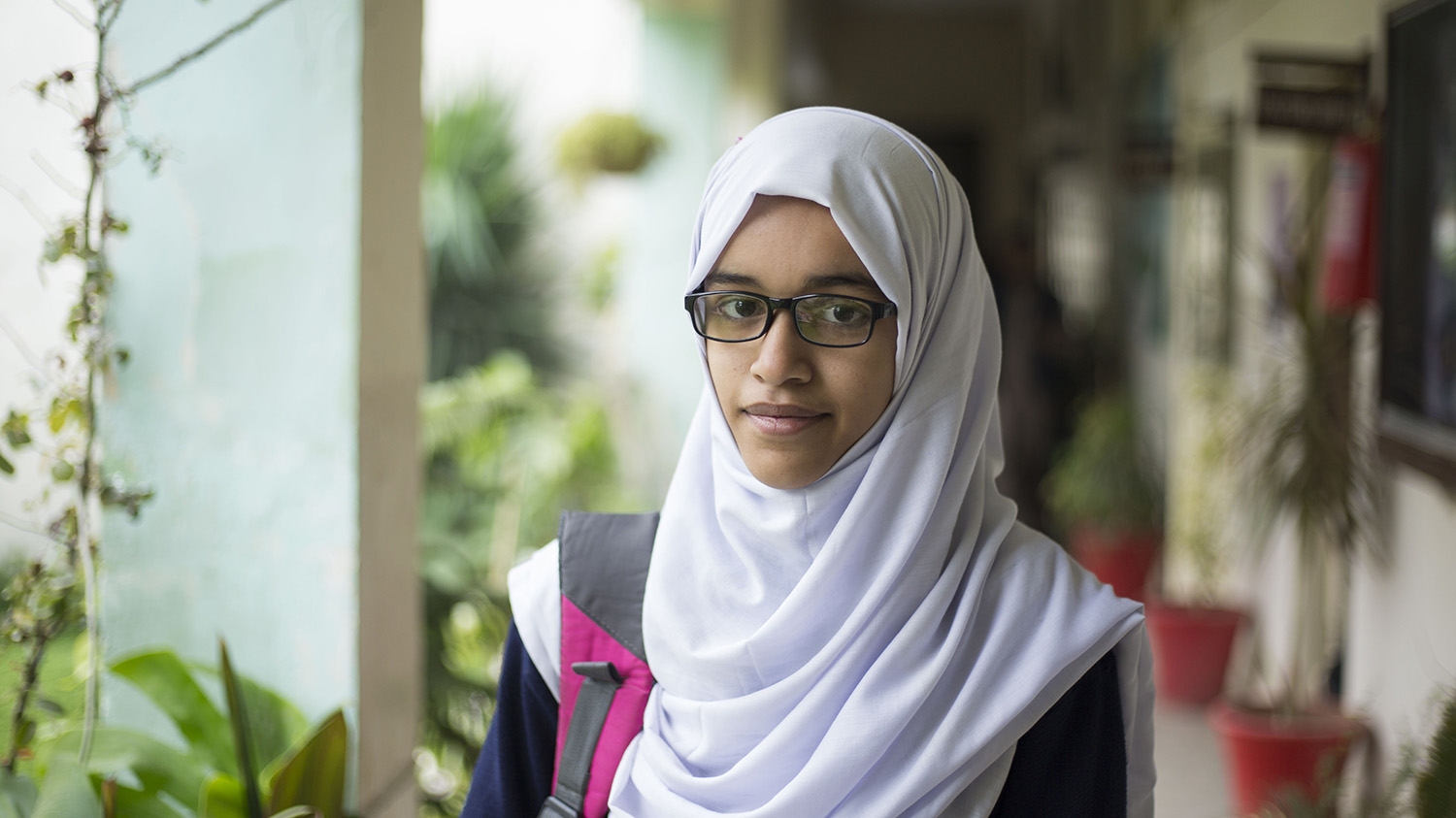Maryam wears glasses which were prescribed to her after an eye screening by her teacher at school in Islamabad.