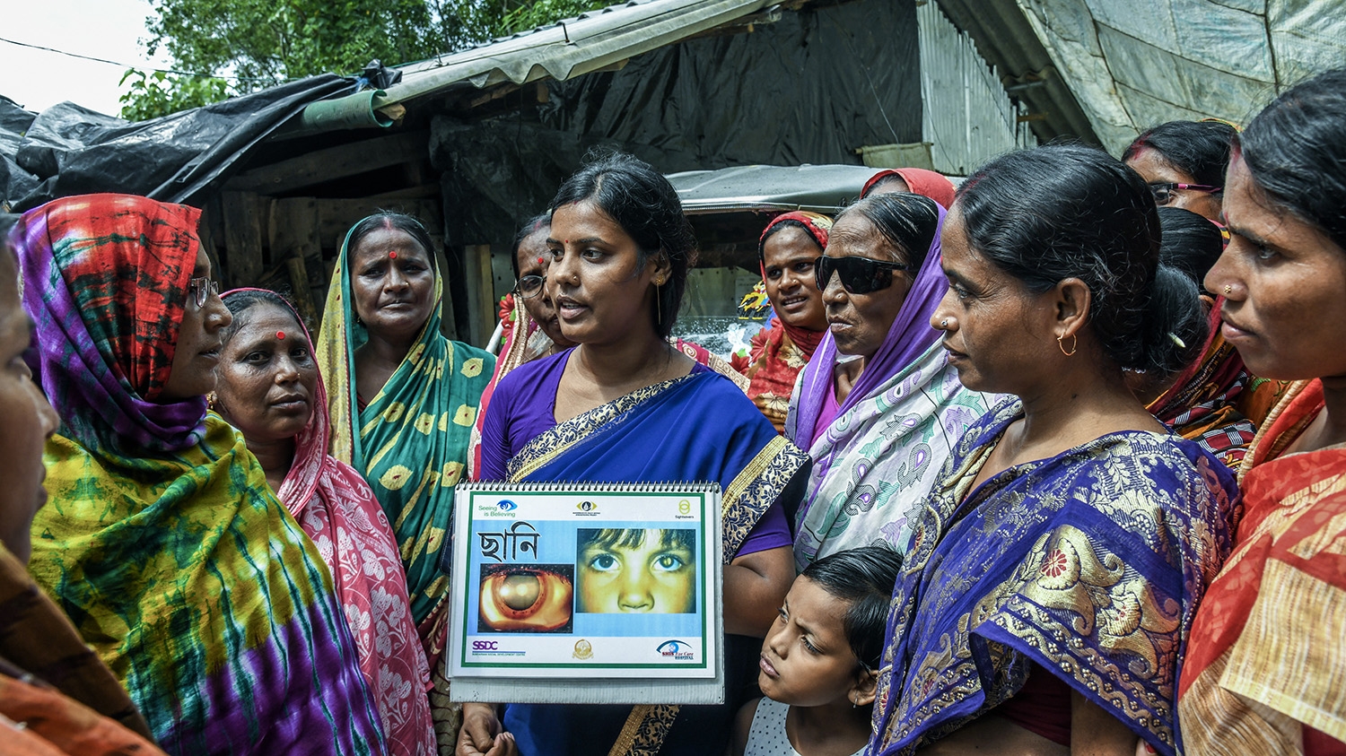 A Lady Health Worker conducts an awareness activity on cataracts for a group of women in the Sundarbans, India.