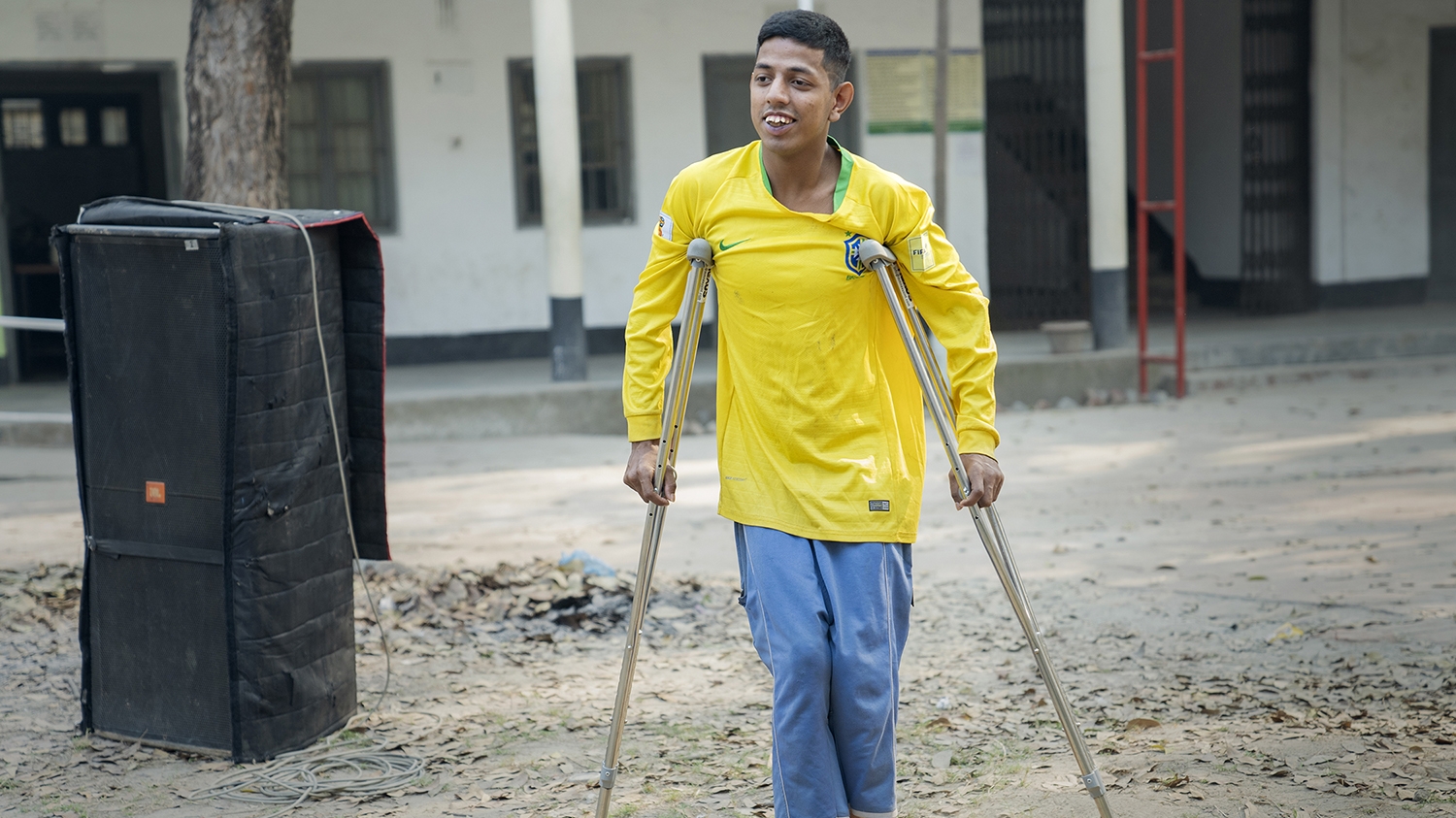 Sadhat, who uses crutches to walk, attends a DPO meeting in Bangladesh.