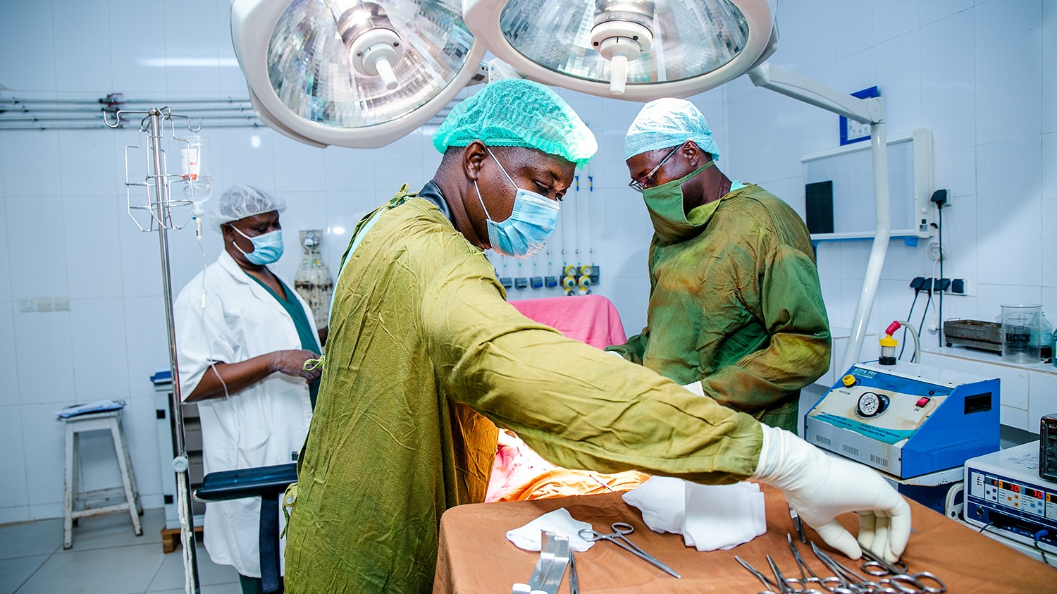 Medical staff perform surgery for hydrocele in an operating theatre.