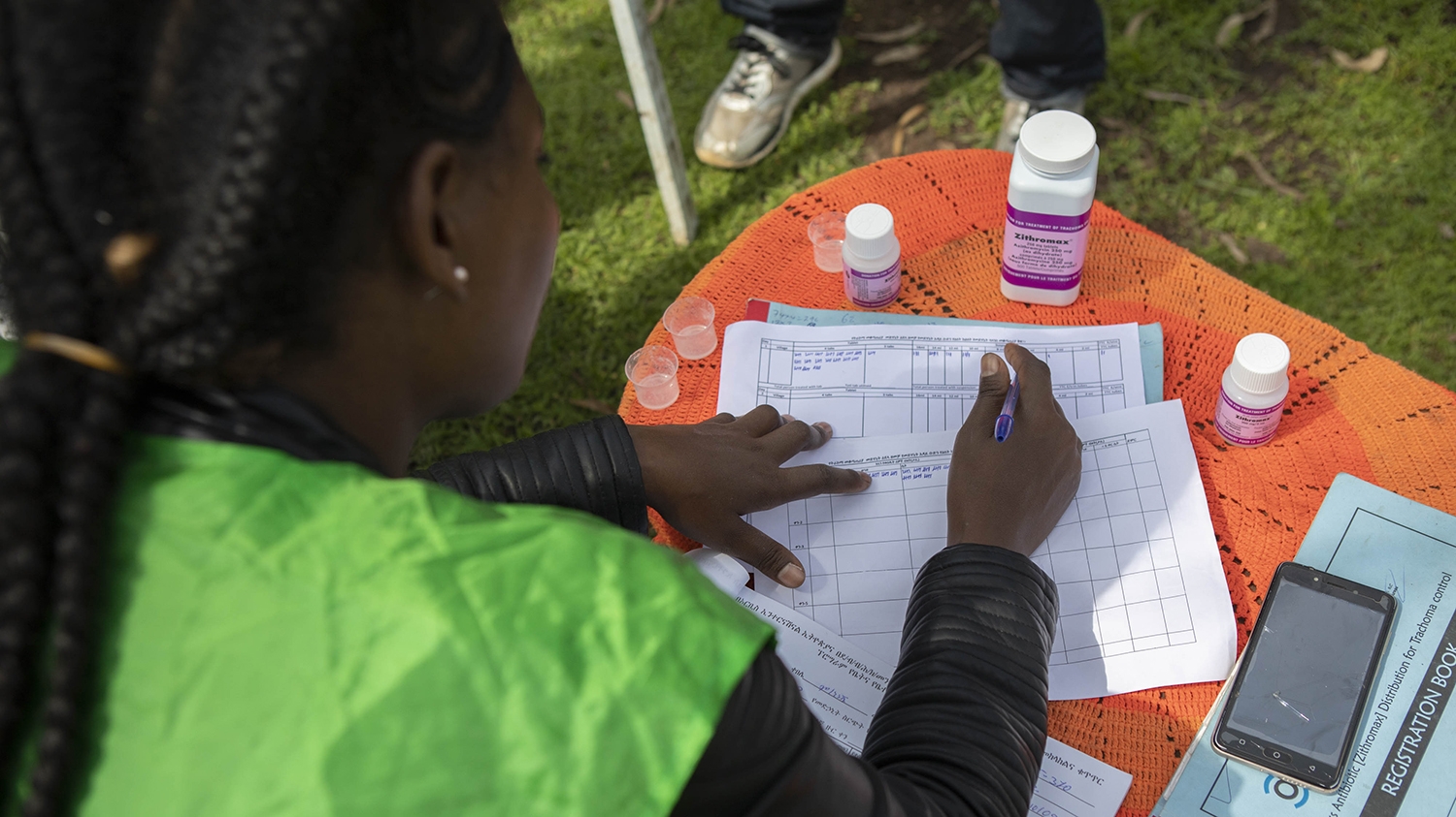 A community health worker completes official documentation during an MDA for trachoma in Ethiopia.